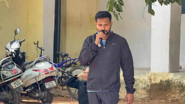 Nikhil speaking during a school yoga programme