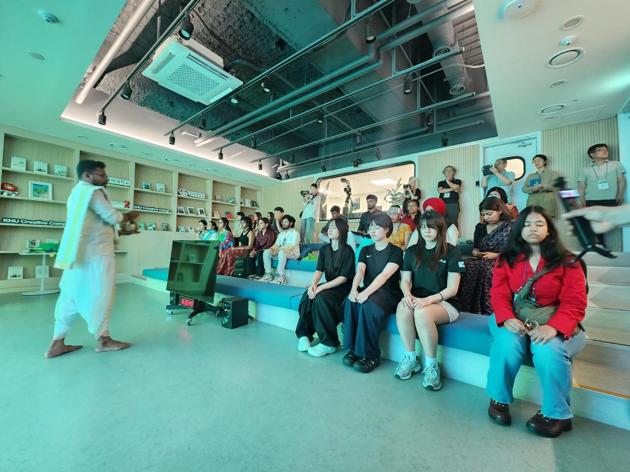 Nikhil participating in a group session in Korea