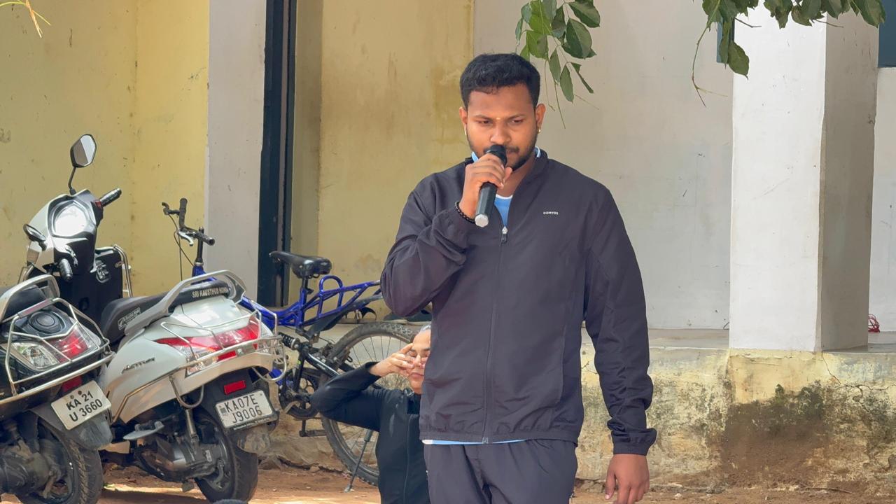 Nikhil speaking during a school yoga programme